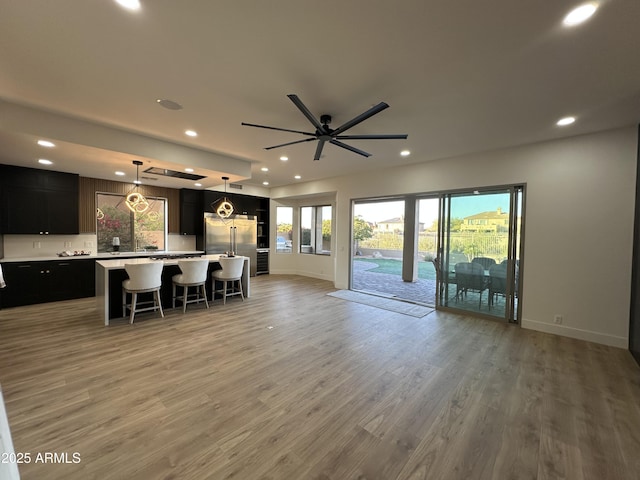 10646 E Butherus Dr, Scottsdale, AZ 85255 - kitchen featuring open floor plan, recessed lighting, stainless steel built in fridge, light countertops, and baseboards