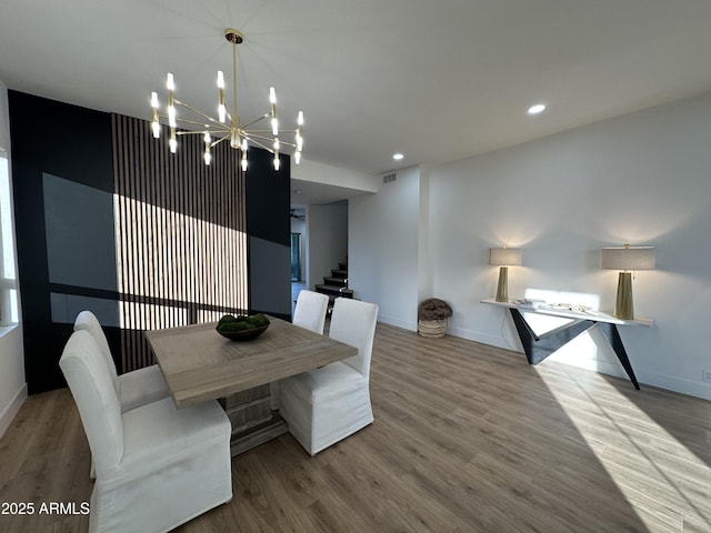 10646 E Butherus Dr, Scottsdale, AZ 85255 - dining area with a chandelier, wood finished floors, baseboards, stairs, and recessed lighting