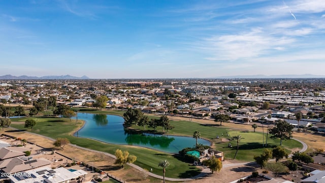 birds eye view of property with a water and mountain view