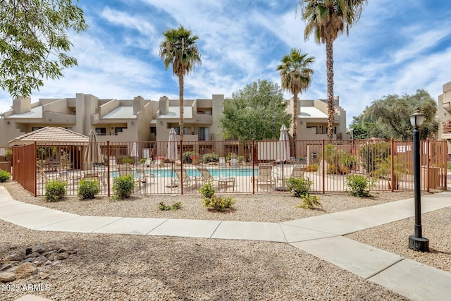 4850 E Desert Cove Ave Unit 240, Scottsdale, AZ 85254 - pool with fence and a residential view