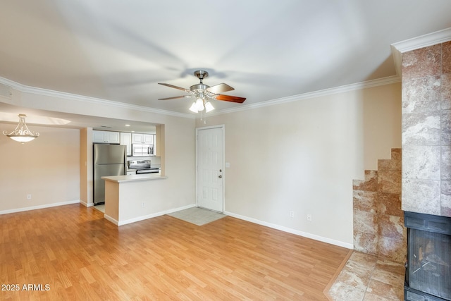 4850 E Desert Cove Ave Unit 240, Scottsdale, AZ 85254 - unfurnished living room with crown molding, light wood-style flooring, ceiling fan, and baseboards