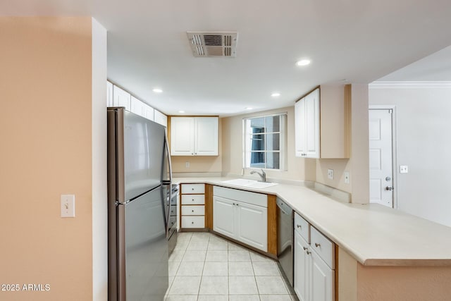 4850 E Desert Cove Ave Unit 240, Scottsdale, AZ 85254 - kitchen with visible vents, a peninsula, a sink, light tile patterned floors, and stainless steel appliances