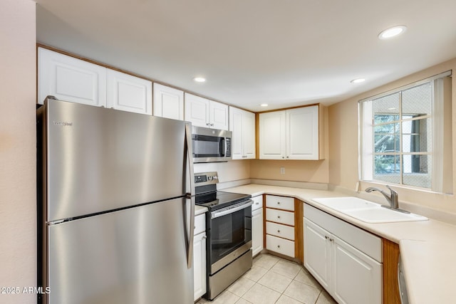 4850 E Desert Cove Ave Unit 240, Scottsdale, AZ 85254 - kitchen with appliances with stainless steel finishes, a sink, light countertops, white cabinetry, and recessed lighting