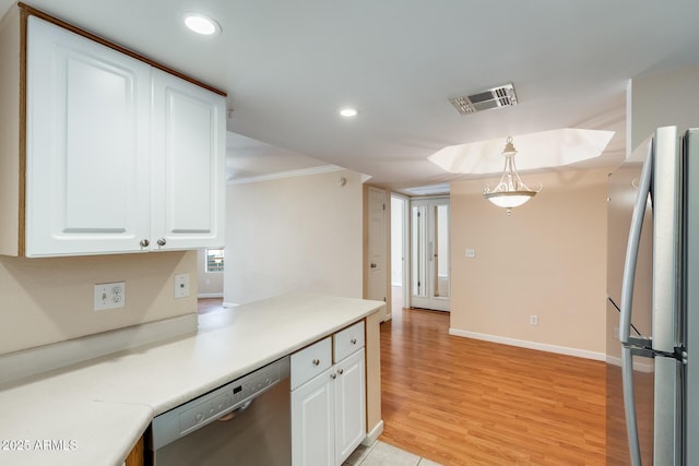 4850 E Desert Cove Ave Unit 240, Scottsdale, AZ 85254 - kitchen featuring crown molding, white cabinets, stainless steel appliances, recessed lighting, and visible vents