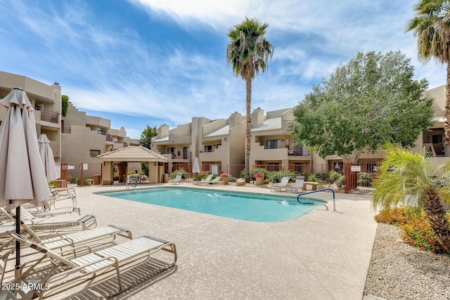 4850 E Desert Cove Ave Unit 240, Scottsdale, AZ 85254 - community pool featuring a residential view, fence, a gazebo, and a patio area