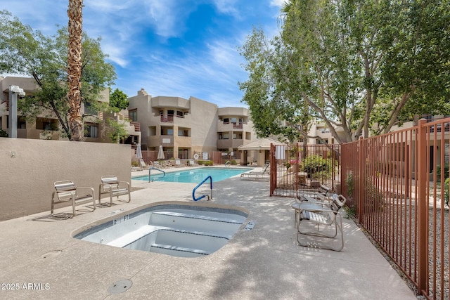 4850 E Desert Cove Ave Unit 240, Scottsdale, AZ 85254 - pool featuring fence, a hot tub, and a patio area