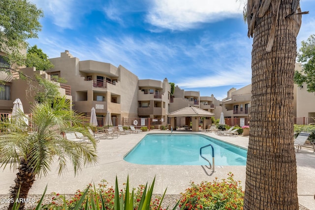 4850 E Desert Cove Ave Unit 240, Scottsdale, AZ 85254 - community pool featuring a patio and a residential view