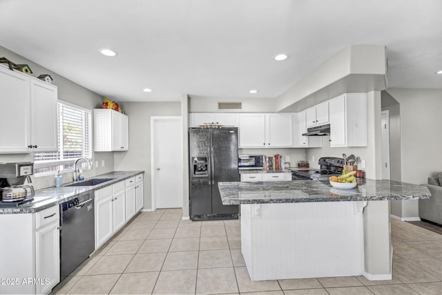 kitchen featuring white cabinets, a sink, under cabinet range hood, and black appliances