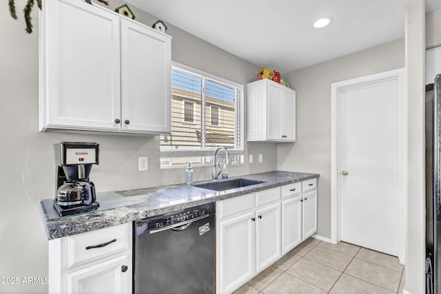 kitchen with a sink, white cabinets, and dishwasher