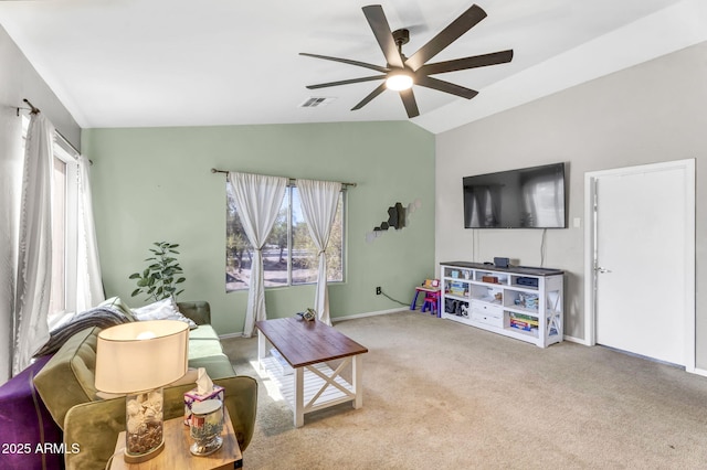 living area with light carpet, visible vents, baseboards, lofted ceiling, and ceiling fan