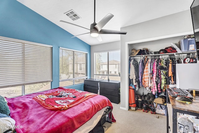 bedroom featuring lofted ceiling, visible vents, a ceiling fan, a closet, and carpet