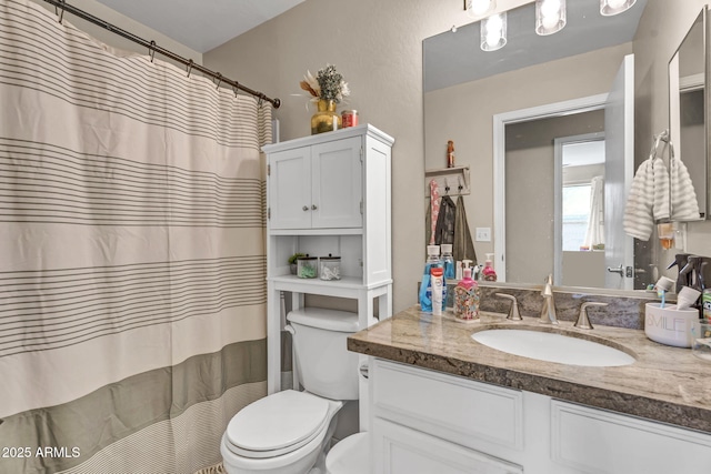 full bath with toilet and vanity