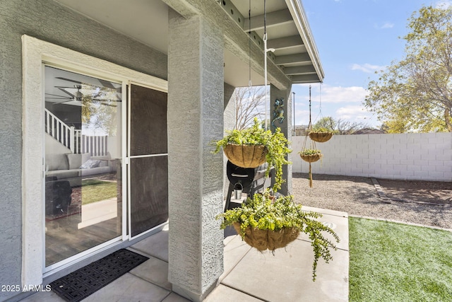 view of patio / terrace featuring fence