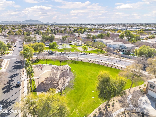 drone / aerial view featuring a residential view and a mountain view