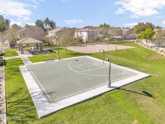 view of sport court with a residential view, volleyball court, a yard, and a gazebo