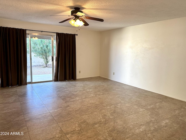 empty room featuring a textured ceiling and ceiling fan