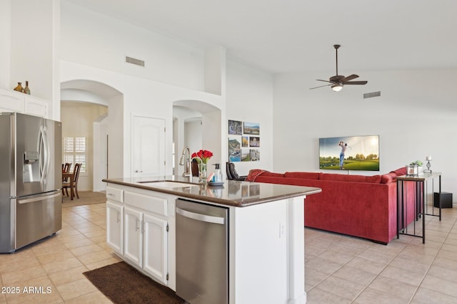 4936 E Villa Rita Dr, Scottsdale, AZ 85254 - kitchen featuring visible vents, white cabinets, dark countertops, appliances with stainless steel finishes, and a sink