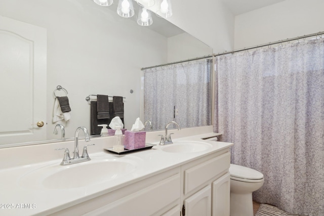 4936 E Villa Rita Dr, Scottsdale, AZ 85254 - full bathroom featuring double vanity, a sink, toilet, and a notable chandelier