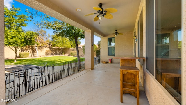 view of patio featuring ceiling fan