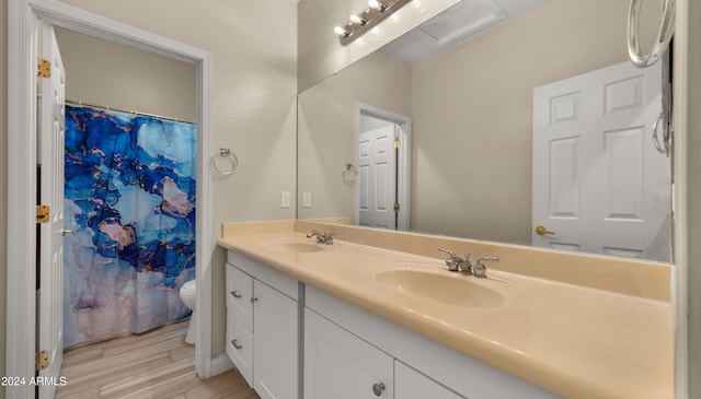 bathroom with vanity, hardwood / wood-style floors, curtained shower, and toilet