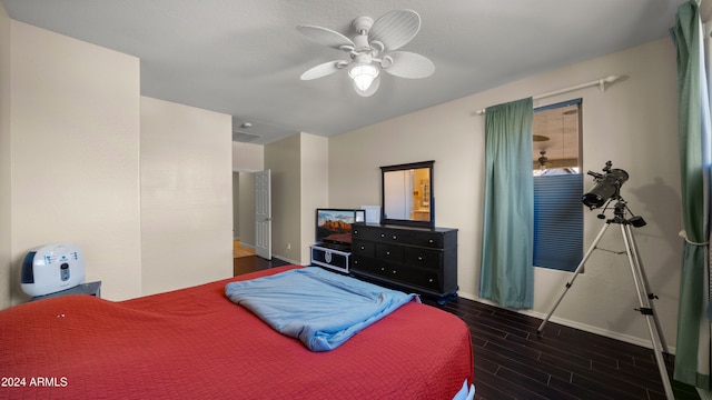 bedroom featuring ceiling fan and dark hardwood / wood-style floors