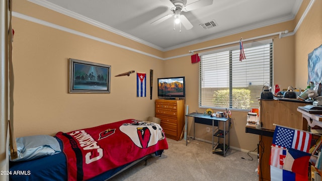 carpeted bedroom featuring ornamental molding and ceiling fan