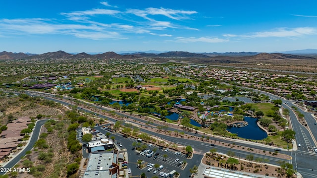 drone / aerial view featuring a water and mountain view