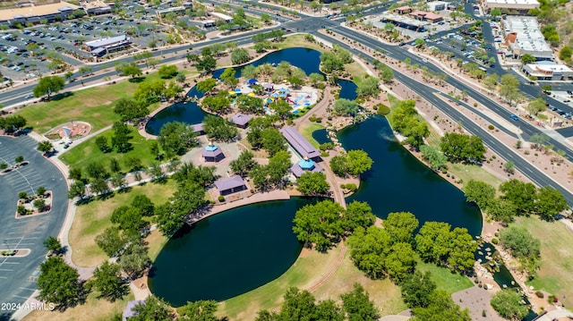 birds eye view of property with a water view