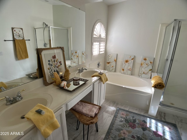 bathroom featuring double vanity, a sink, a garden tub, and a stall shower