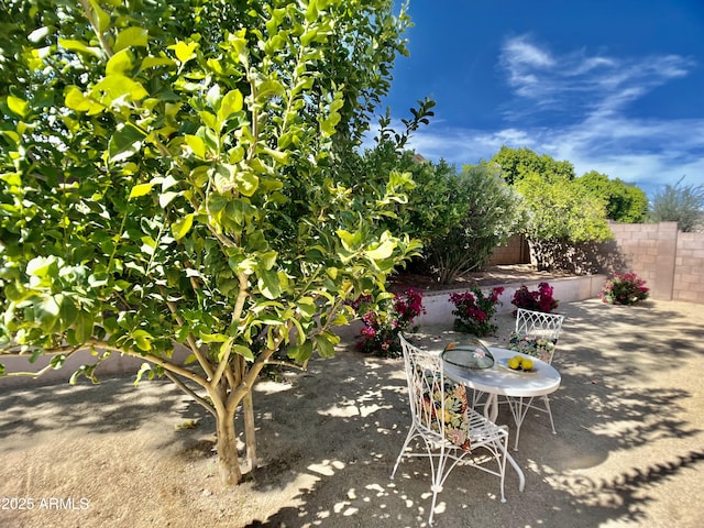 view of patio featuring fence