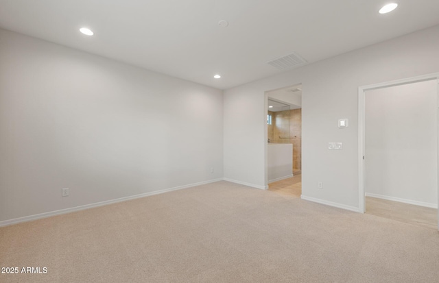 spare room with light colored carpet