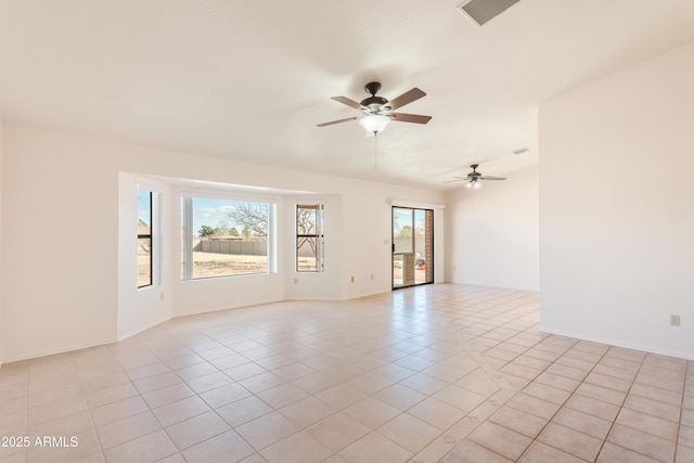 tiled empty room featuring ceiling fan