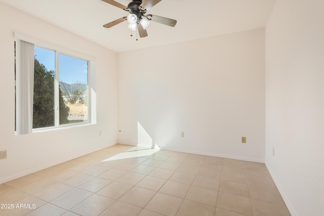 unfurnished room with light tile patterned flooring and ceiling fan