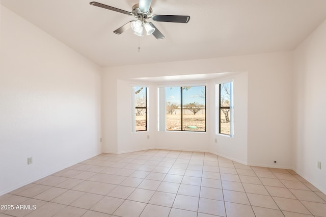 spare room with light tile patterned flooring and ceiling fan