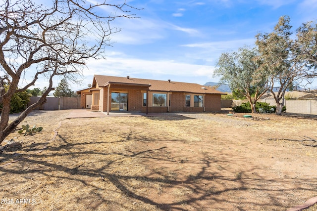 rear view of property with a patio area