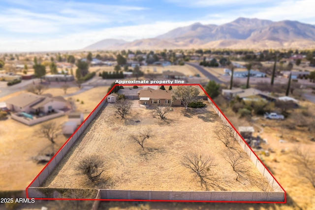 birds eye view of property featuring a mountain view