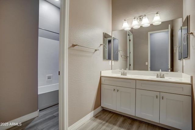 5552 N Kerwood Loop, Prescott Valley, AZ 86314 - full bath featuring wood finished floors, double vanity, and a tub to relax in