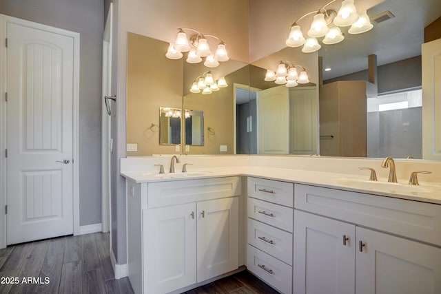 5552 N Kerwood Loop, Prescott Valley, AZ 86314 - full bathroom featuring double vanity, a chandelier, and wood finished floors