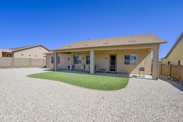 5552 N Kerwood Loop, Prescott Valley, AZ 86314 - back of property with stucco siding, a fenced backyard, and a patio area