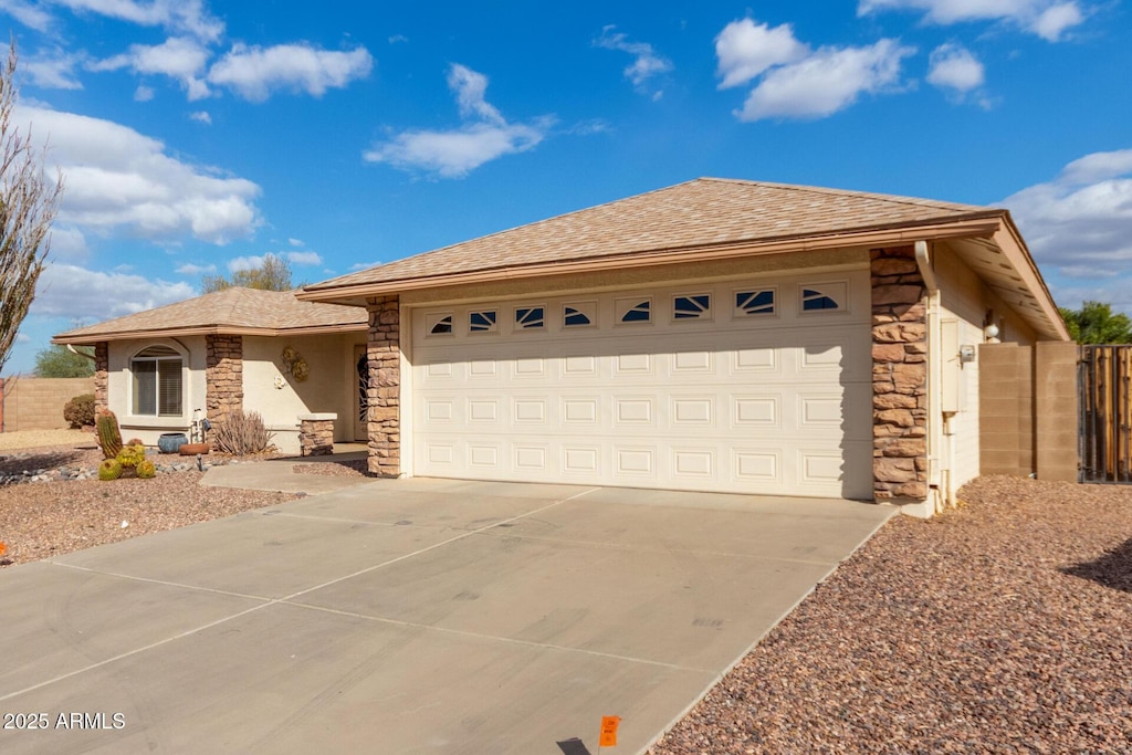 single story home featuring a garage