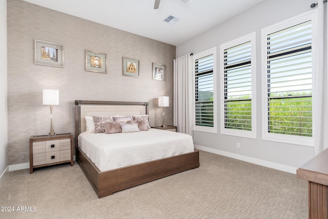 carpeted bedroom featuring ceiling fan