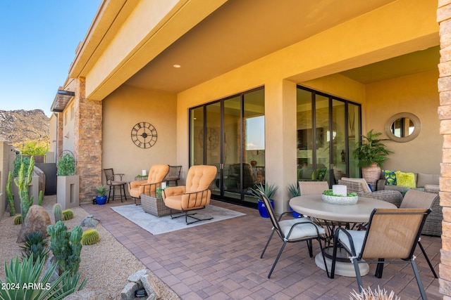 view of patio / terrace featuring a mountain view