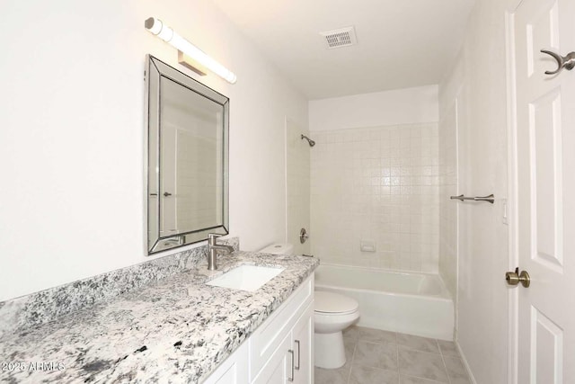 bathroom with toilet, vanity, tile patterned floors, and bathing tub / shower combination