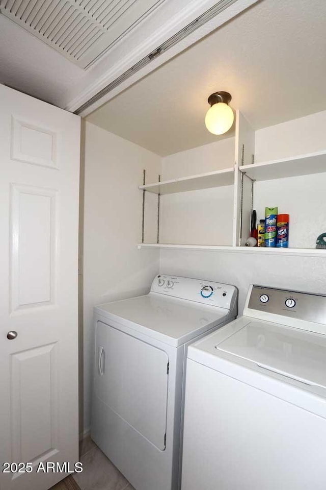laundry area featuring washing machine and dryer