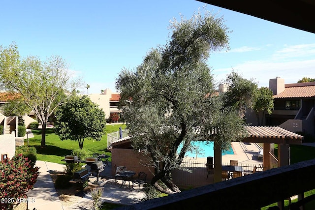 exterior space with stucco siding and a yard