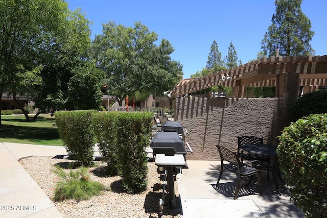surrounding community featuring a patio area and fence