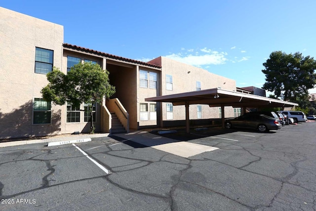 partially covered parking lot with stairway