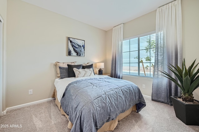 carpeted bedroom with baseboards