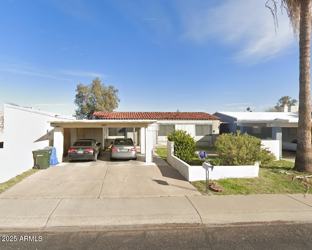 10408 W Devonshire Ave, Phoenix, AZ 85037 - single story home with driveway, a tile roof, a carport, and stucco siding