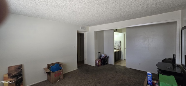 10408 W Devonshire Ave, Phoenix, AZ 85037 - unfurnished living room featuring a textured ceiling and light carpet